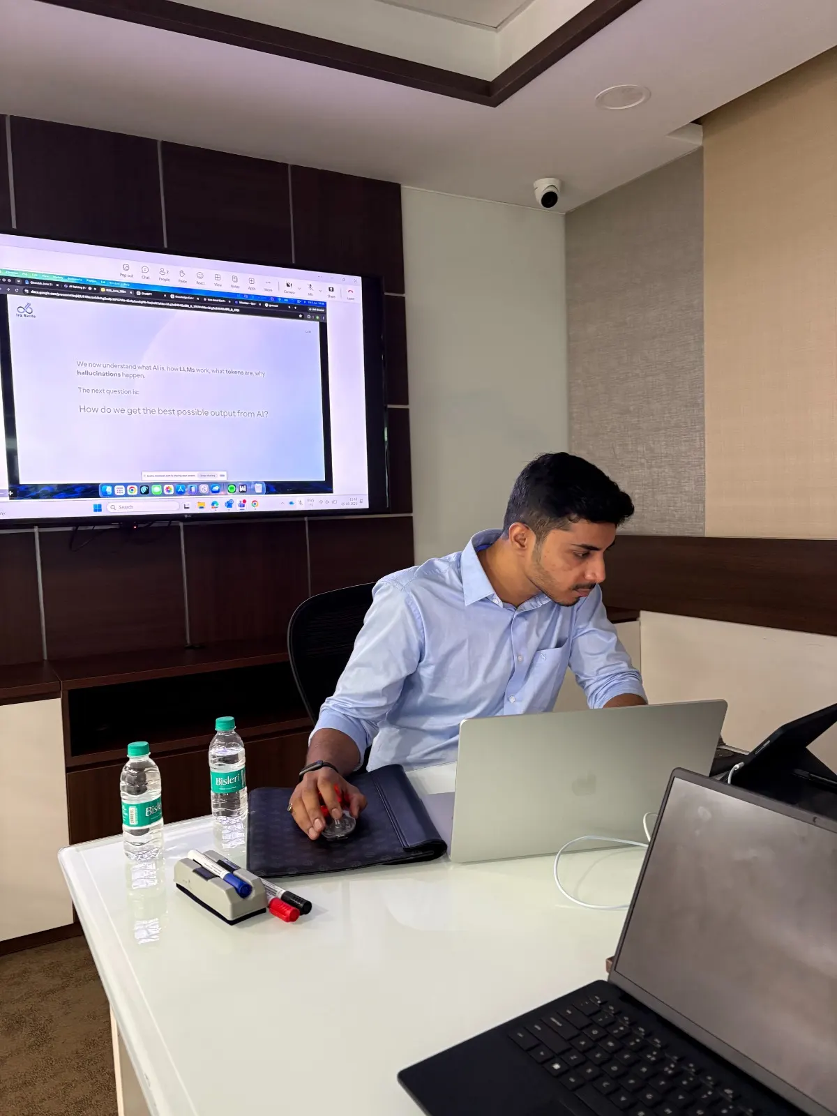 Corporate participants working through a live Excel dashboard exercise on laptops